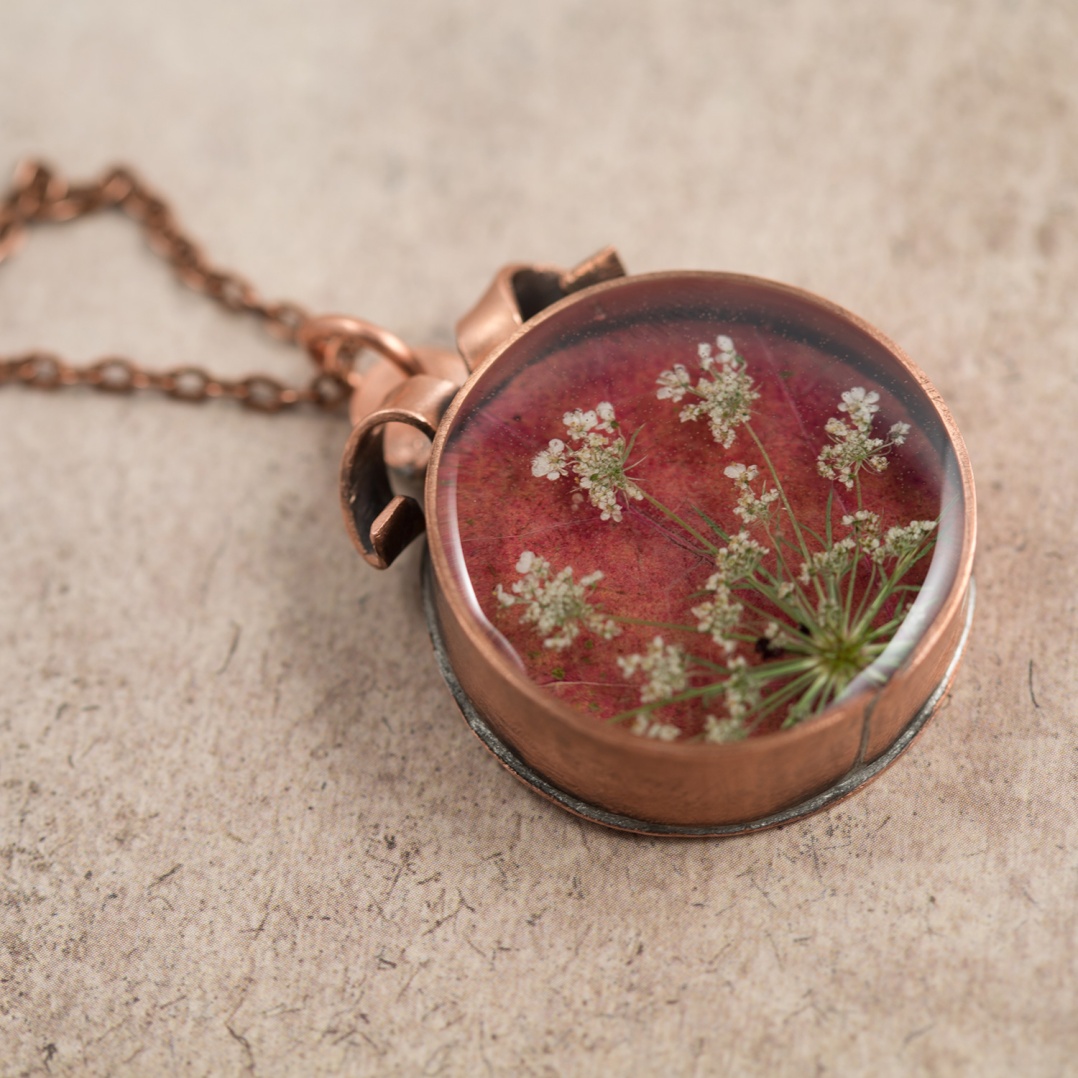 $85 - Real Queen Anne’s lace and Maple leaf, preserved in a handmade copper bezel.